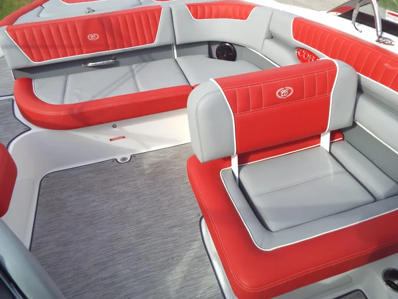 Slide: The Image of 2021 Cobalt CS22 boat interior with red and gray seating, modern design. - 5