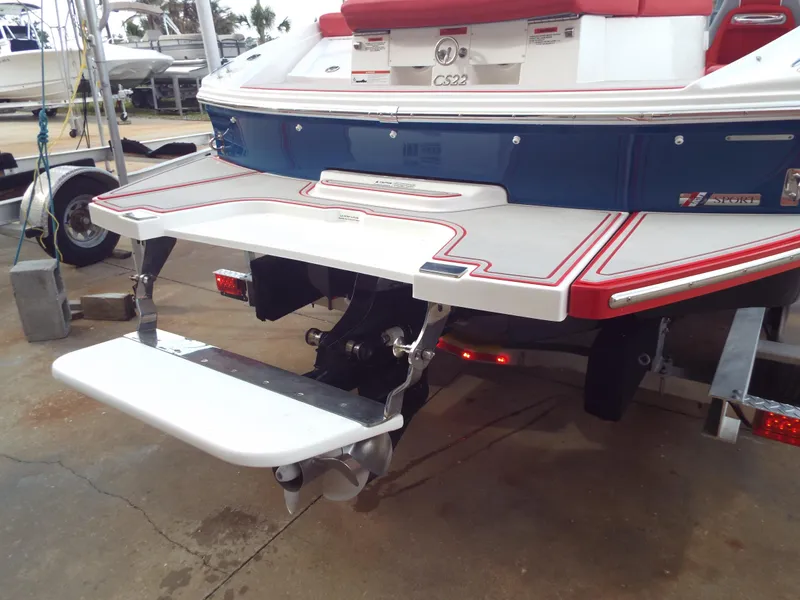 Slide: The Image of 2021 Cobalt CS22 boat rear view with swim platform and outdrive. - 9