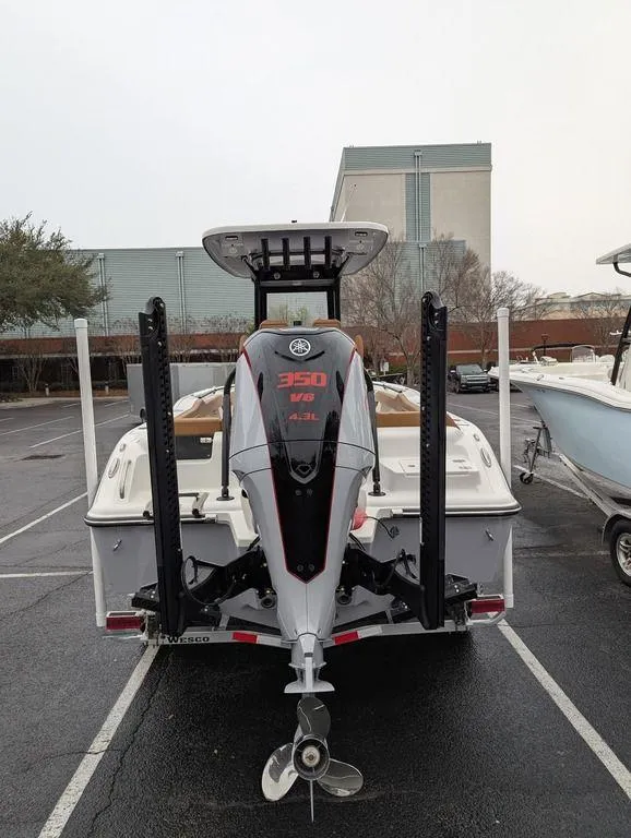 Slide: The Image of 2025 Key West 239 FSR boat with powerful 350 HP engine in parking lot. - 3