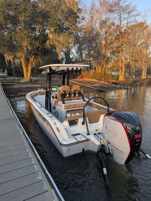 Slide: The Image of 2025 Key West 239 FSR boat docked by a scenic lakeside. - 4