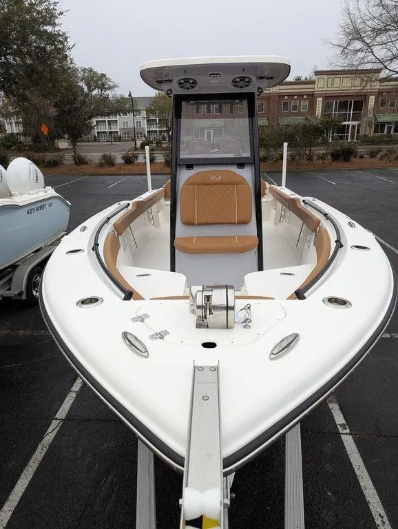 Slide: The Image of 2025 Key West 239 FSR boat with sleek design, parked in urban setting. - 8