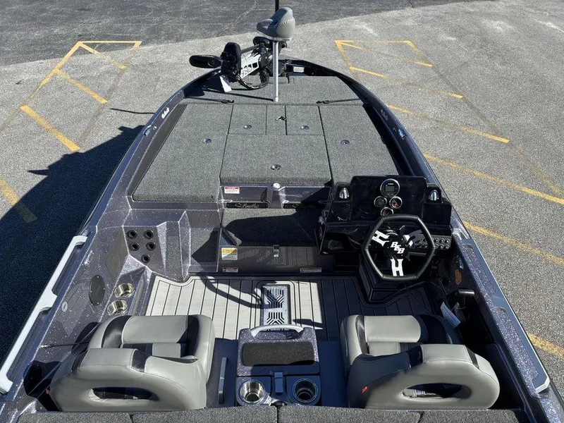 Slide: The Image of 2025 Bass Cat Puma STS boat interior with dual seats and advanced dashboard. - 8