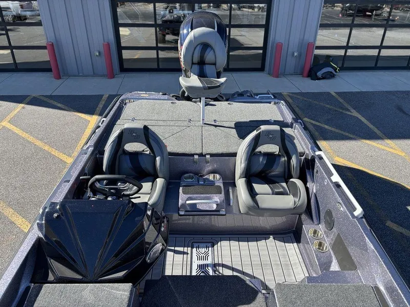 Slide: The Image of 2025 Bass Cat Puma STS boat interior with dual seats and modern dashboard. - 9
