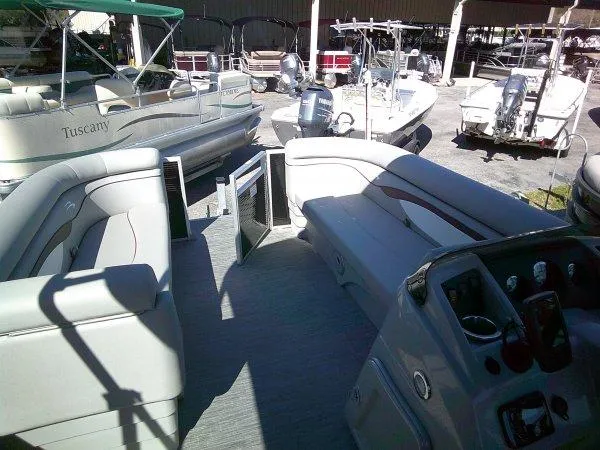 Slide: The Image of 2023 Bennington 208SLJ Tri-toon interior with spacious seating and modern controls. - 3