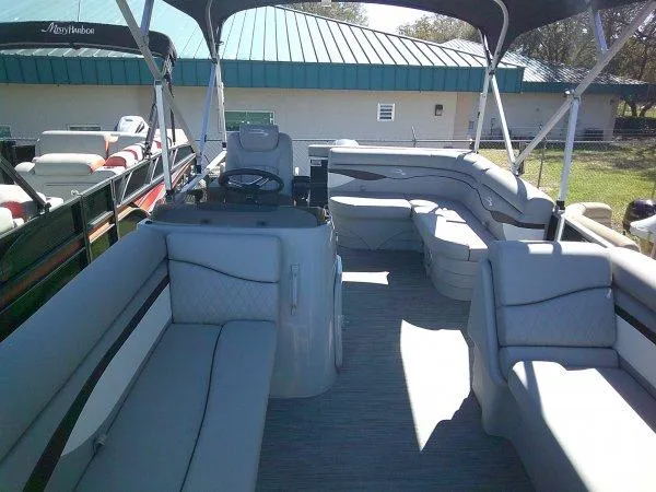 Slide: The Image of 2023 Bennington 208SLJ Tri-toon interior with spacious seating and modern design. - 7