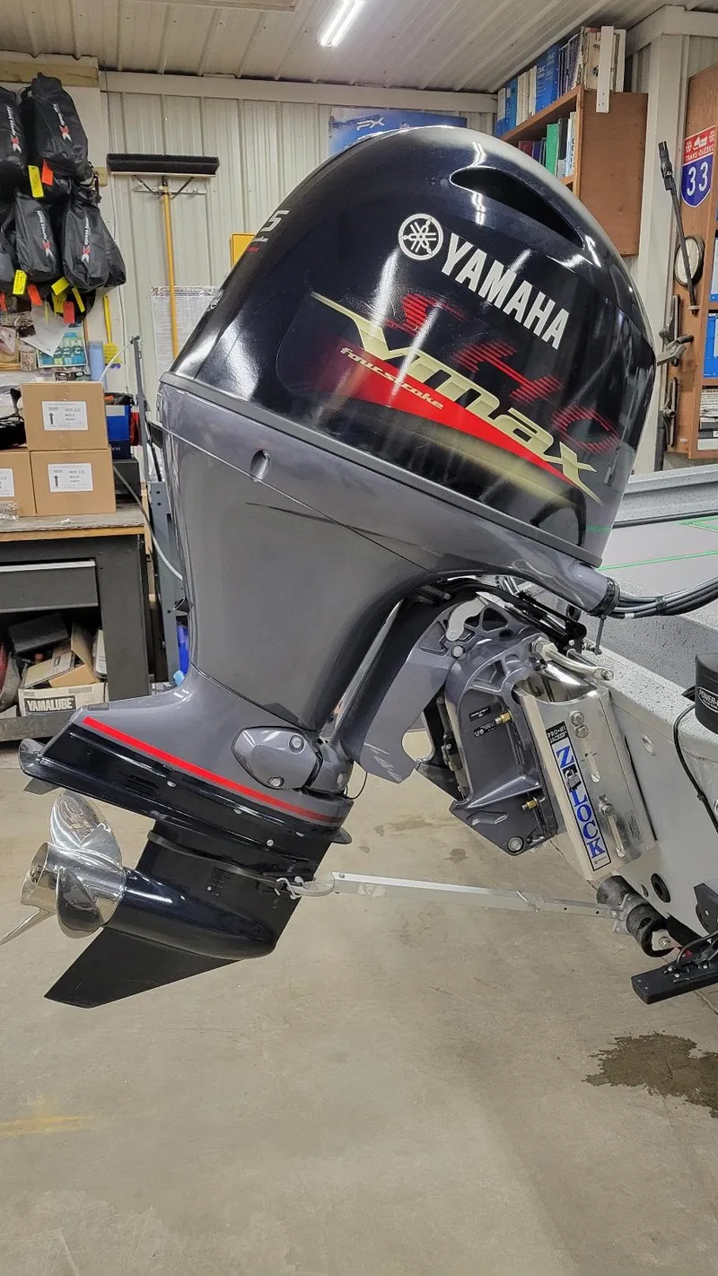 Slide: The Image of 2023 Xpress H18C Crappie with Yamaha Vmax 115 SHO outboard engine in a workshop. - 10
