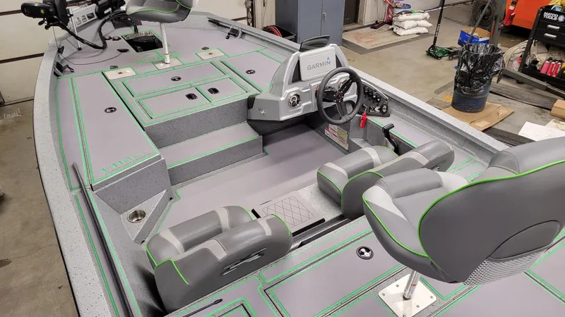 Slide: The Image of 2023 Xpress H18C Crappie boat interior with Garmin system and Yamaha Vmax 115 SHO engine. - 12