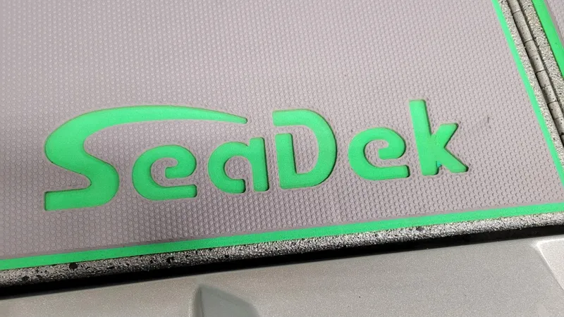 Slide: The Image of SeaDek logo on Xpress H18C Crappie boat, 2023 model, featuring Yamaha Vmax 115 SHO. - 14