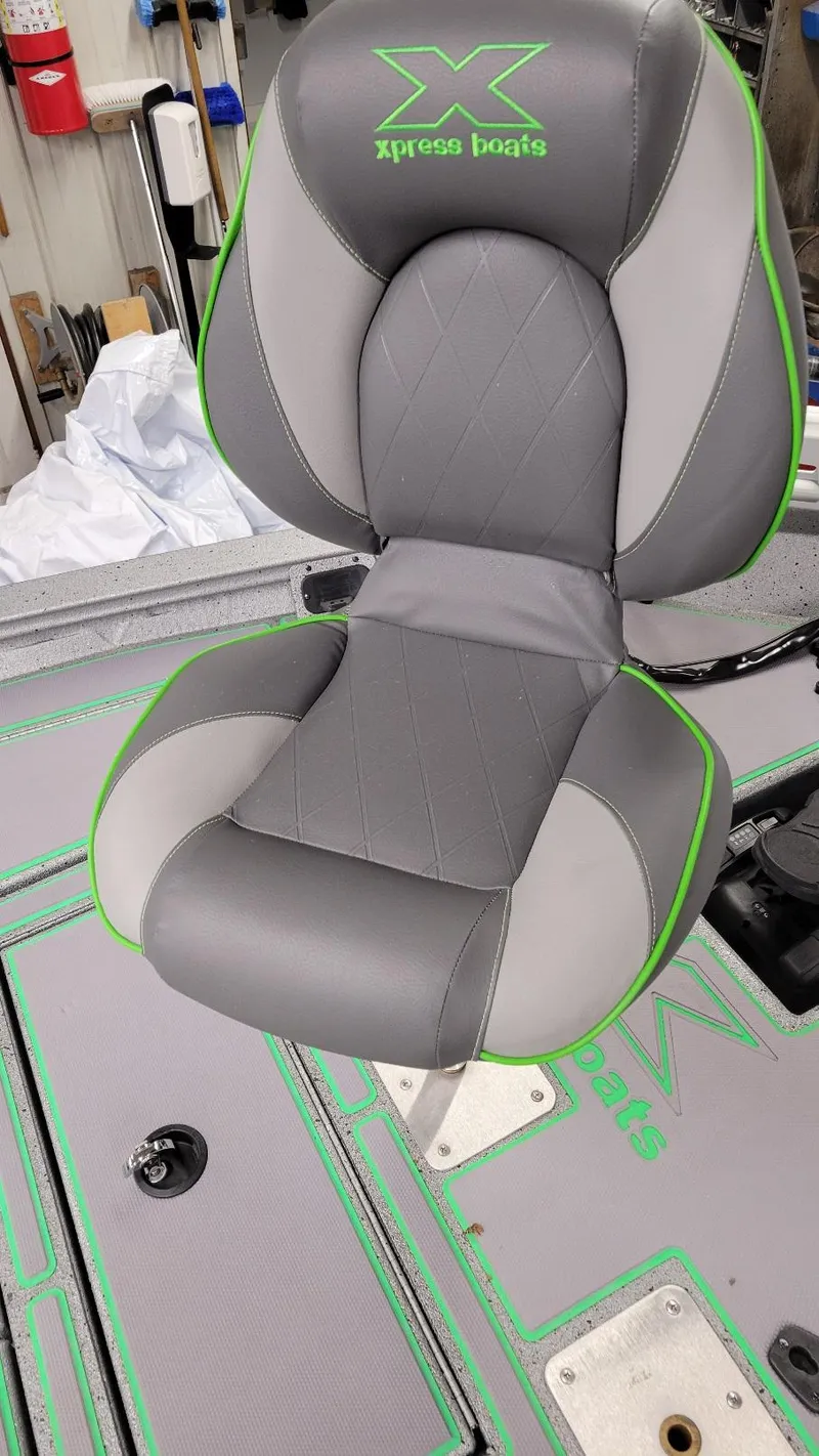 Slide: The Image of 2023 Xpress H18C Crappie boat seat, gray with green accents, in stock. - 16
