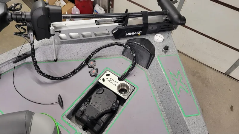 Slide: The Image of 2023 Xpress H18C Crappie boat deck with Minn Kota trolling motor. - 3