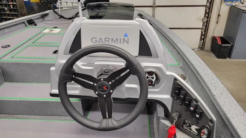 Slide: The Image of 2023 Xpress H18C Crappie boat dashboard with Garmin system and Yamaha Vmax 115 SHO engine. - 5