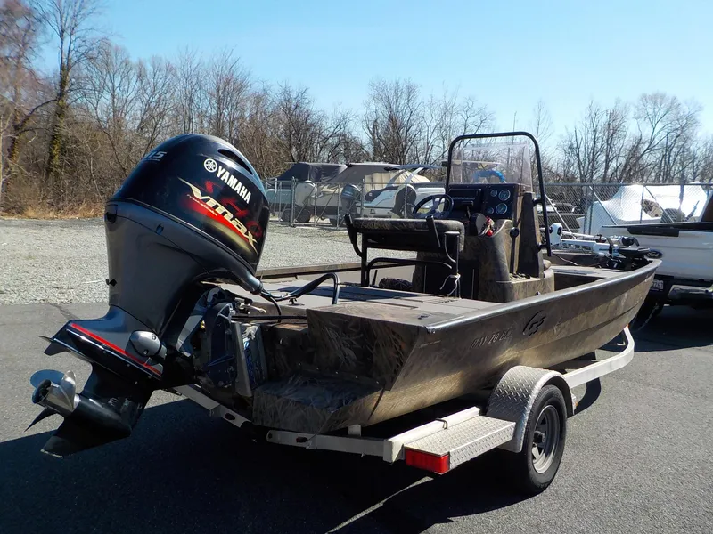 Slide: The Image of 2019 G3 Bay 20 DLX Camo boat with Yamaha outboard motor on trailer. - 7