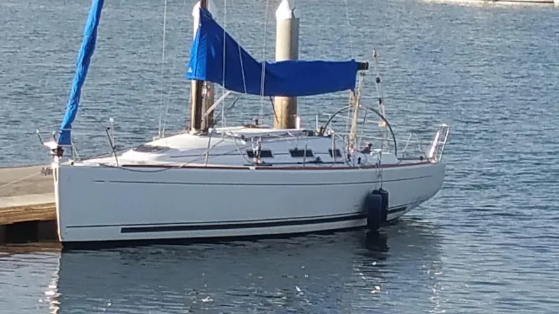 Slide: The Image of 2007 Beneteau First 10R sailboat docked with blue sail cover. - 2