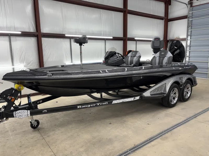 Slide: The Image of 2025 Ranger Z519R boat in a garage, on a trailer, with sleek black design. - 3