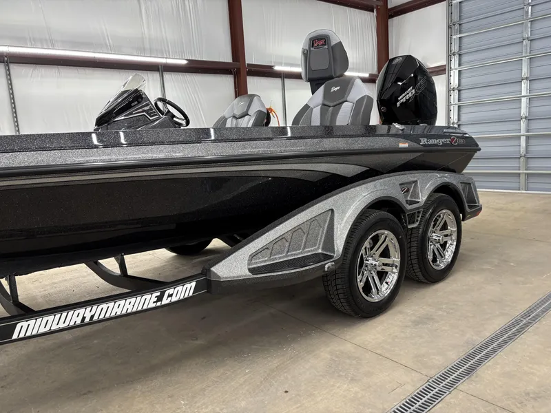 Slide: The Image of 2025 Ranger Z519R boat in a garage, featuring sleek design and dual wheels. - 4
