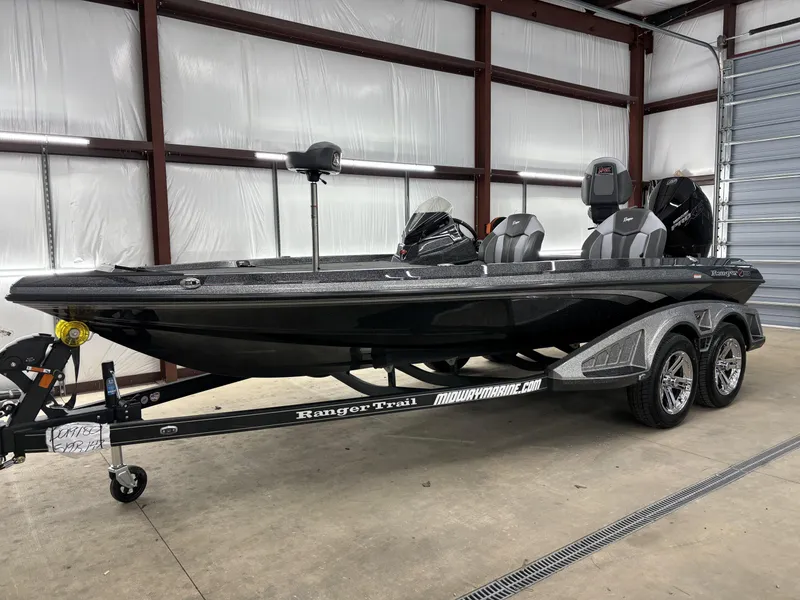Slide: The Image of 2025 Ranger Z519R bass boat in a garage, on a Ranger Trail trailer. - 8