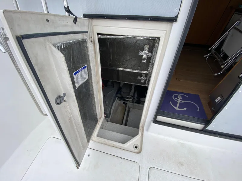Slide: The Image of 2001 Bayliner 3988 engine compartment with open access hatch. - 36