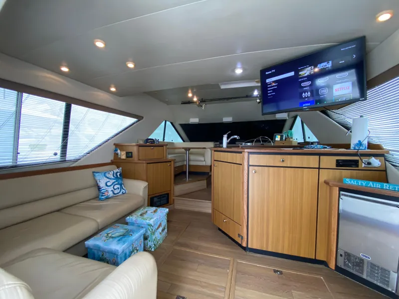 Slide: The Image of Interior of 2001 Bayliner 3988 yacht with modern furnishings and entertainment system. - 7