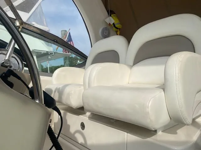 Slide: The Image of Interior of 2003 Sea Ray 340 Sundancer with white leather seating. - 13