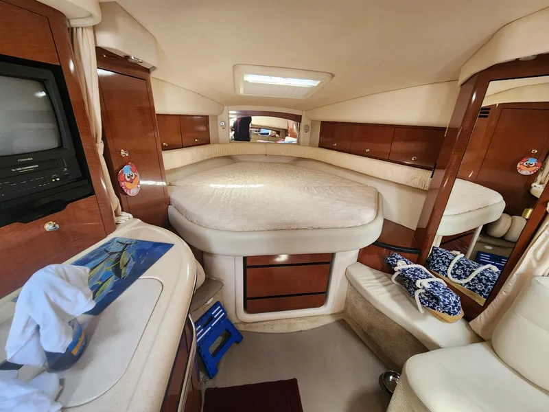Slide: The Image of Interior of 2003 Sea Ray 340 Sundancer yacht with cozy cabin and bed. - 16