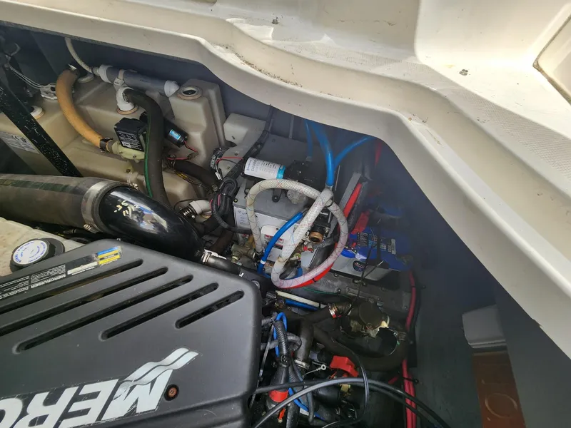 Slide: The Image of Engine compartment of a 2003 Sea Ray 340 Sundancer boat, showing mechanical components. - 20