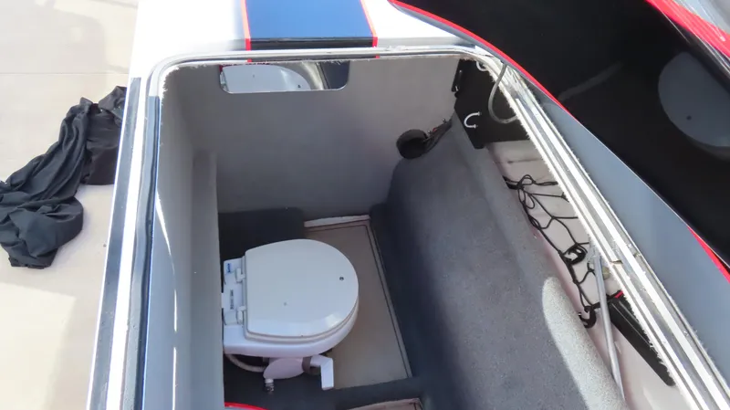 Slide: The Image of 2014 MTI 44 boat interior with compact toilet in storage compartment. - 32