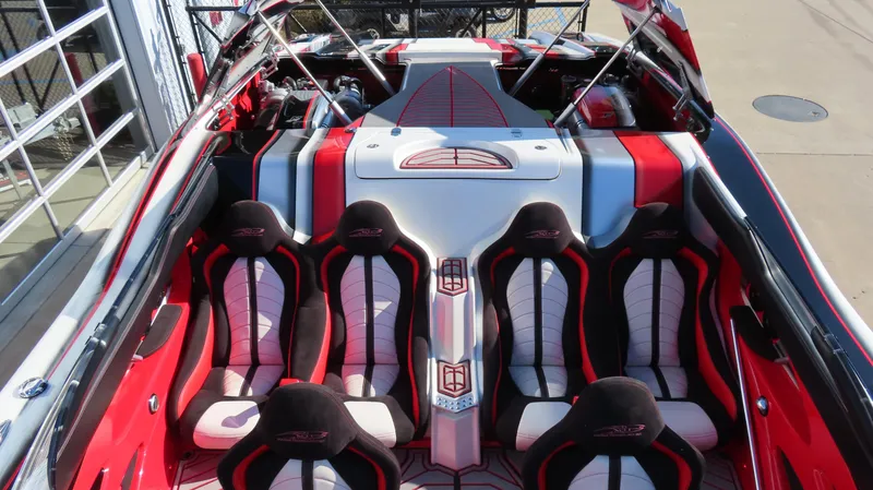 Slide: The Image of 2014 MTI 44 boat interior with red and black seating, sleek design. - 33
