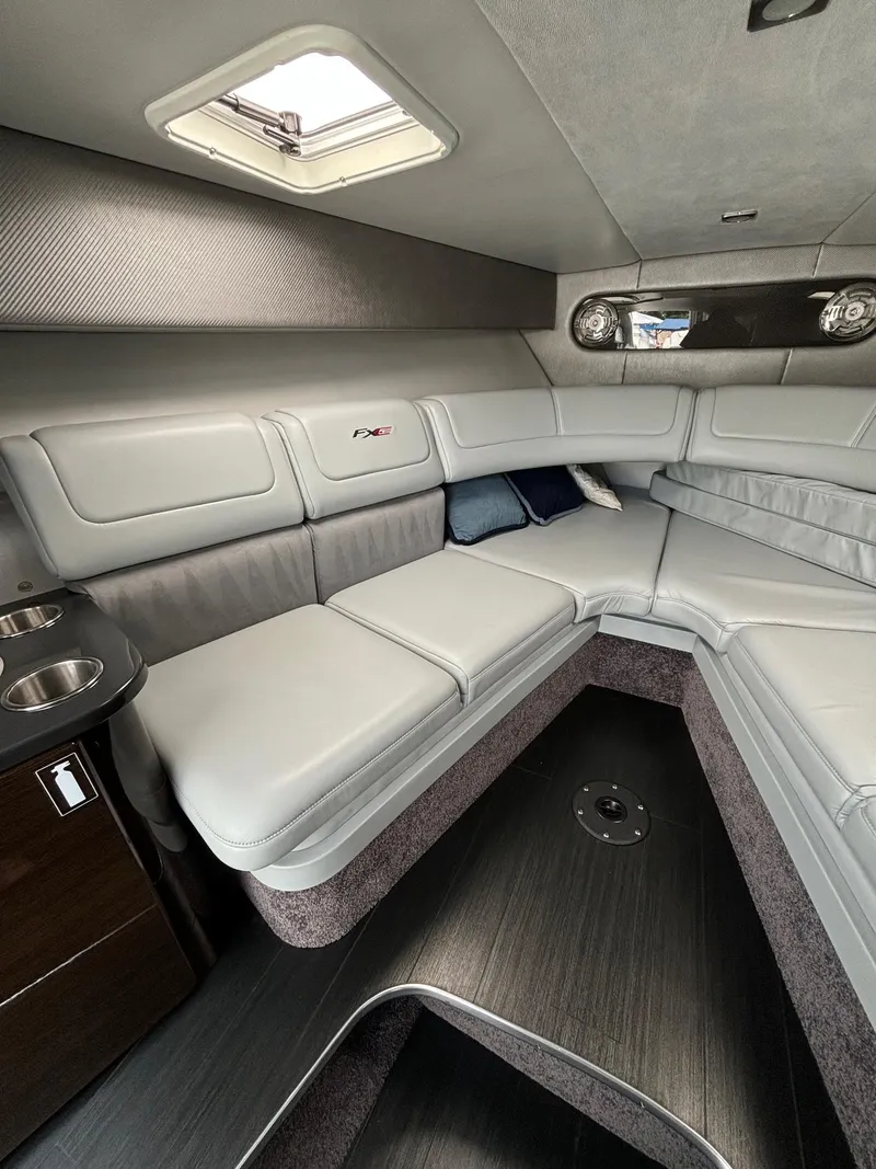 Slide: The Image of 2014 Formula 310 FX5 boat interior with sleek gray seating and modern design. - 10