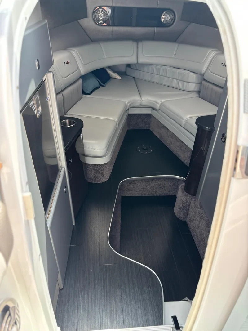 Slide: The Image of 2014 Formula 310 FX5 cabin interior with sleek seating and modern design. - 11