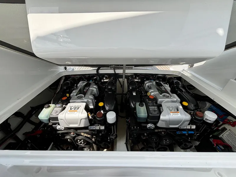 Slide: The Image of Twin V8 engines in a 2014 Formula 310 FX5 boat, showcasing powerful marine performance. - 12