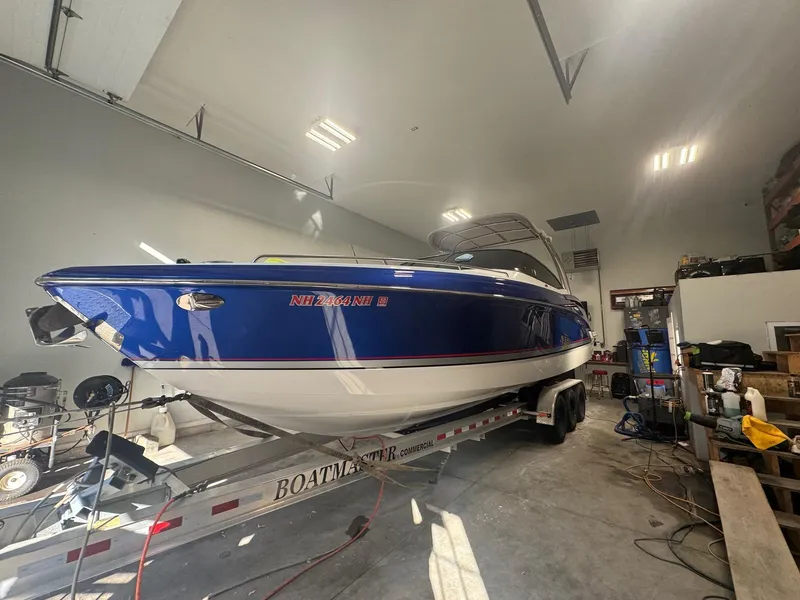 Slide: The Image of 2014 Formula 310 FX5 boat on trailer in indoor storage facility. - 18