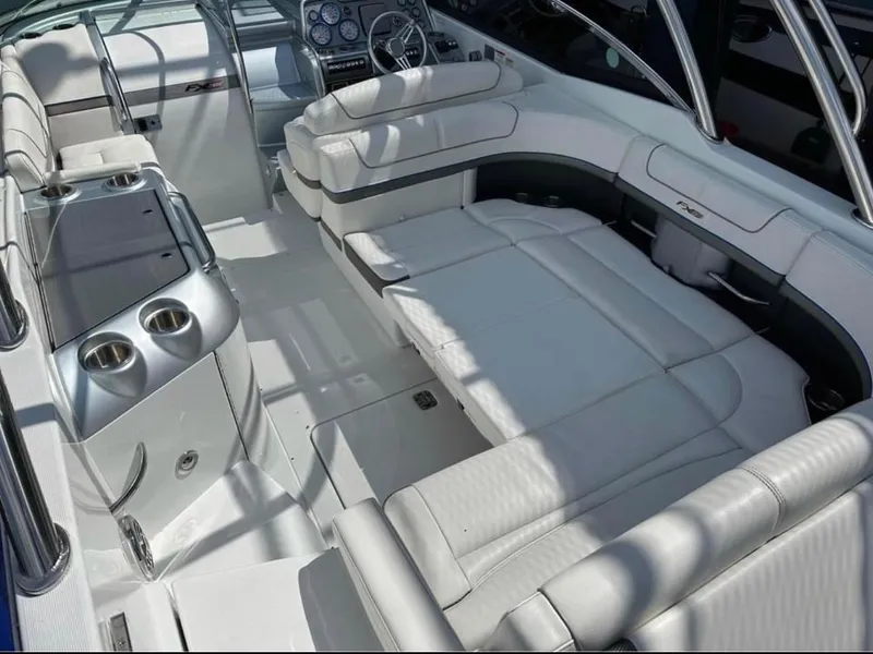Slide: The Image of Luxurious interior of a 2014 Formula 310 FX5 boat with plush white seating. - 5