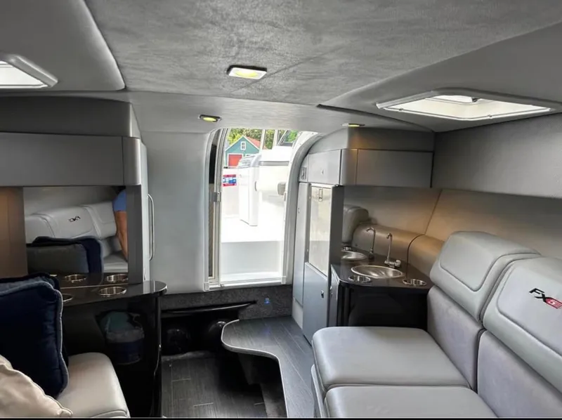Slide: The Image of Luxurious interior of a 2014 Formula 310 FX5 boat with modern seating and amenities. - 6