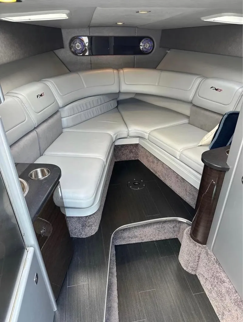 Slide: The Image of 2014 Formula 310 FX5 cabin interior with plush seating and modern design. - 7