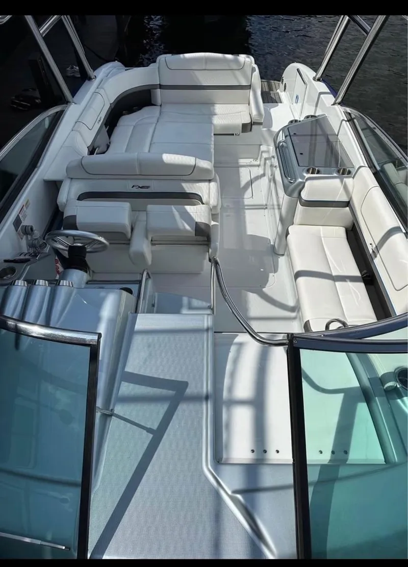 Slide: The Image of 2014 Formula 310 FX5 boat interior with white seating and sleek design. - 8