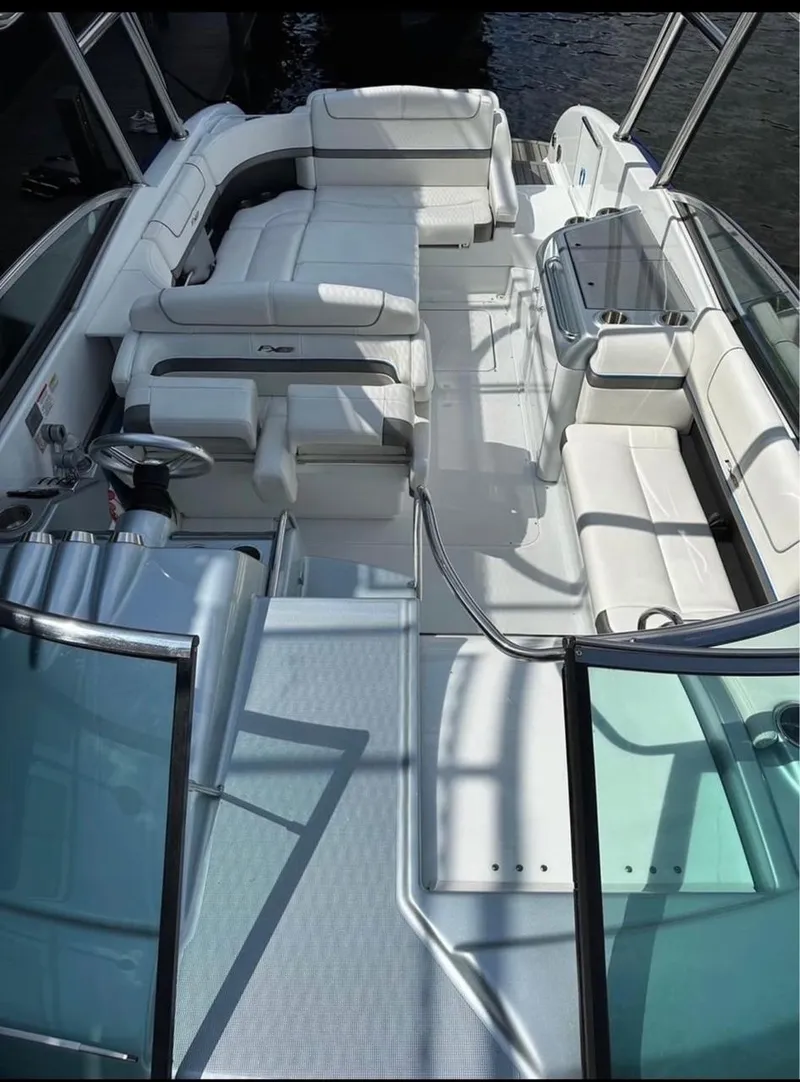 Slide: The Image of 2014 Formula 310 FX5 boat interior with white seating and sleek design. - 9