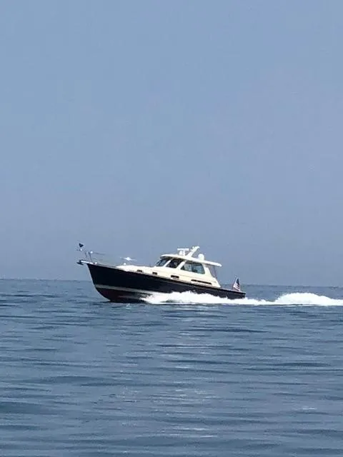 Slide: The Image of 2008 Sabre 38 Hardtop Express cruising on open water. - 17