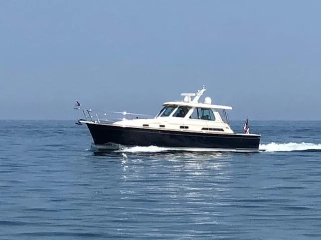 Slide: The Image of 2008 Sabre 38 Hardtop Express cruising on calm ocean waters. - 18