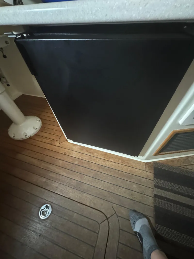 Slide: The Image of Interior of 2008 Sabre 38 Hardtop Express with wooden flooring and black panel. - 25