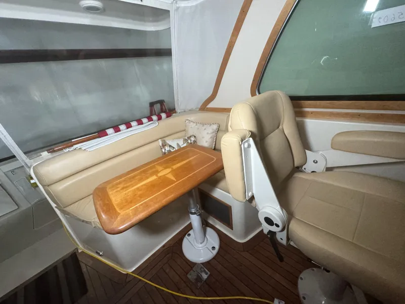 Slide: The Image of Interior of 2008 Sabre 38 Hardtop Express with beige seating and wooden table. - 30