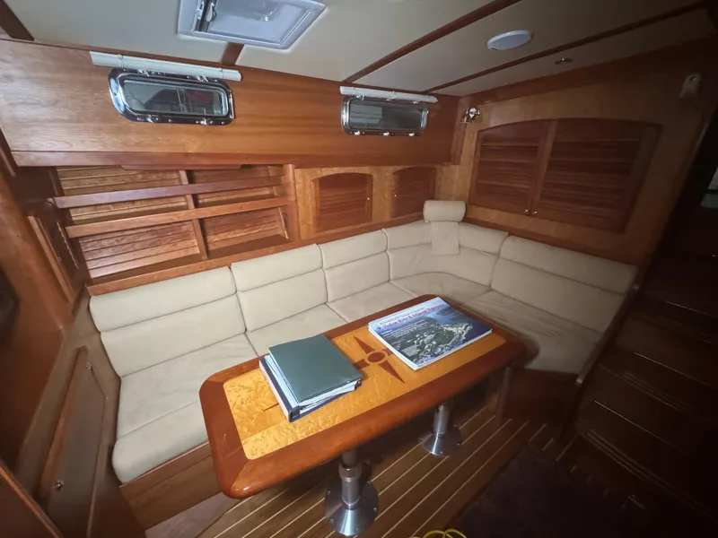 Slide: The Image of Interior of 2008 Sabre 38 Hardtop Express with beige seating and wooden table. - 33