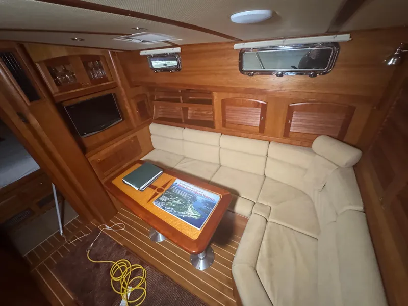 Slide: The Image of Interior of 2008 Sabre 38 Hardtop Express with cozy seating and wooden finishes. - 37