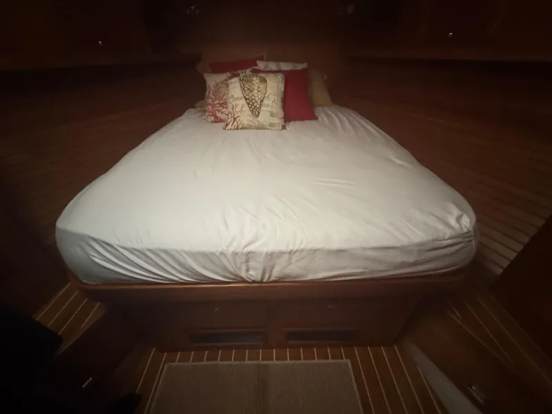 Slide: The Image of Cozy cabin bed in 2008 Sabre 38 Hardtop Express yacht with decorative pillows. - 40