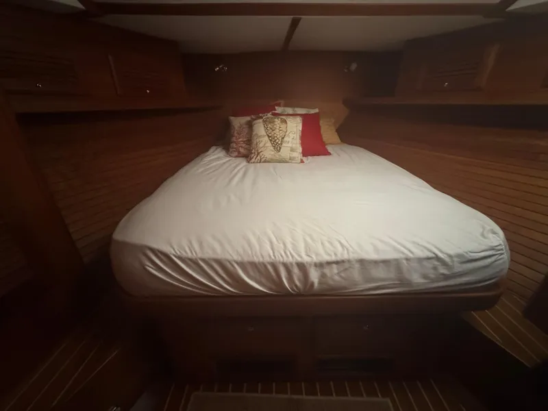 Slide: The Image of Cozy cabin bedroom in 2008 Sabre 38 Hardtop Express yacht with wooden interior. - 41