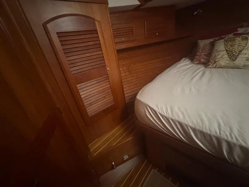 Slide: The Image of Interior cabin of 2008 Sabre 38 Hardtop Express with wooden cabinetry and bed. - 42