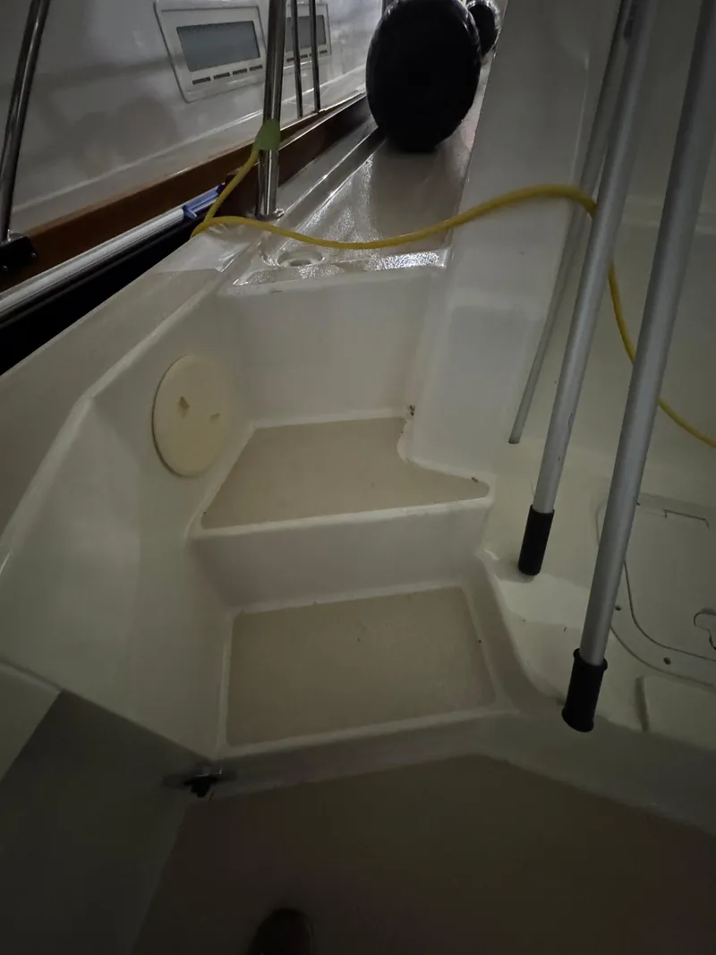 Slide: The Image of 2008 Sabre 38 Hardtop Express boat interior steps with railing and cables. - 49