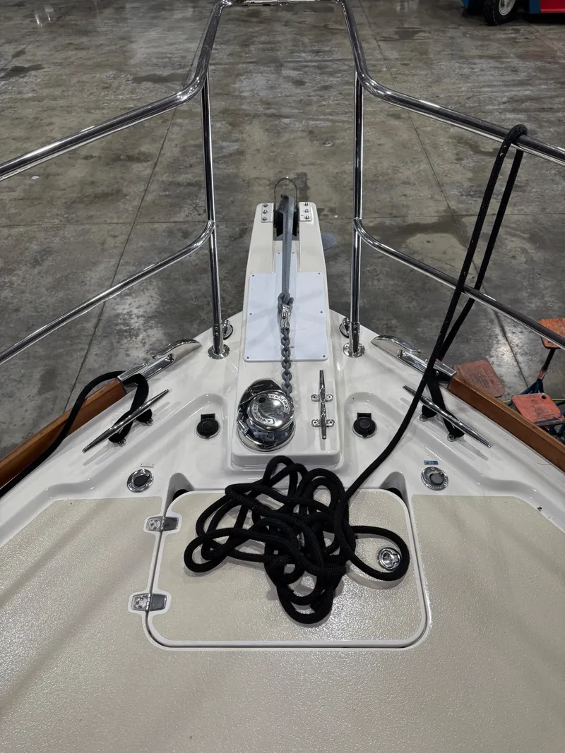 Slide: The Image of Bow of 2008 Sabre 38 Hardtop Express with anchor chain and coiled rope. - 54