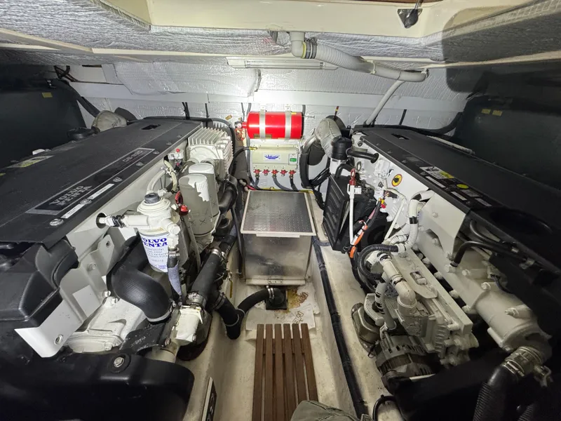 Slide: The Image of Engine room of 2008 Sabre 38 Hardtop Express, featuring dual engines and equipment. - 60