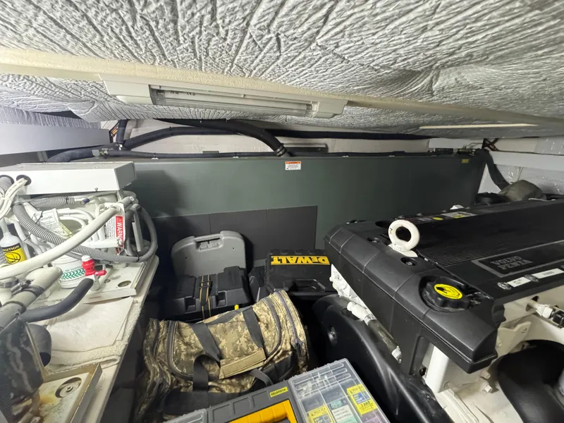 Slide: The Image of Engine room of 2008 Sabre 38 Hardtop Express with tools and equipment. - 64