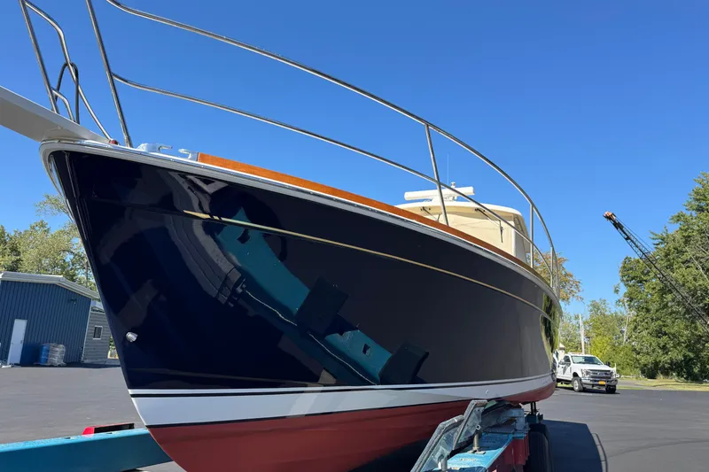 Slide: The Image of 2008 Sabre 38 Hardtop Express boat on trailer under clear blue sky. - 7